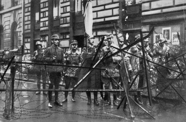 The Munich Putsch. In this photograph are Rudolf Hess (second from left) and Heinrich Himmler (holding flag).