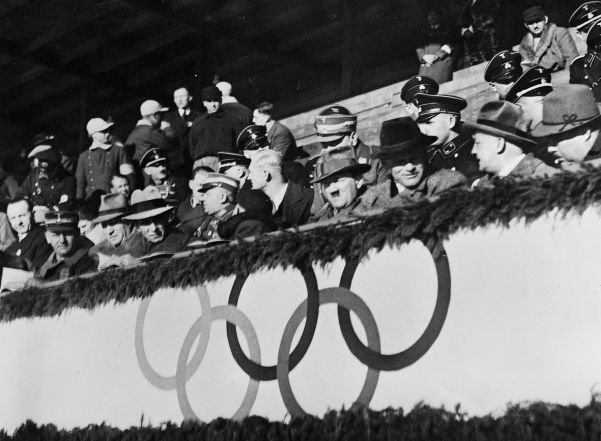 A clearly bored Führer watches an ice hockey game between Great Britain and Hungary at the Olympic Games.