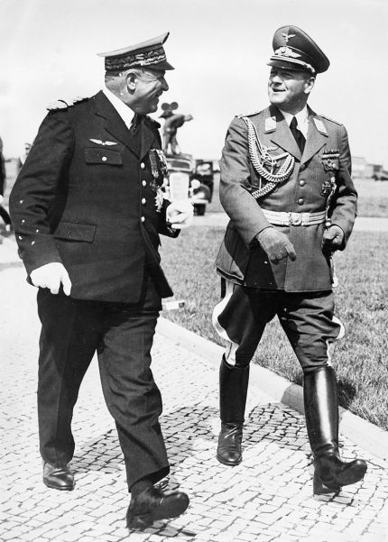 Colonel-General Erhard Milch (right), Luftwaffe commander, laid on a flying display for the Italian dictator.
