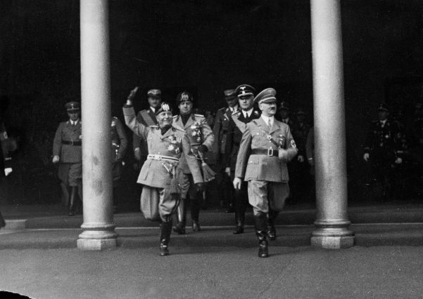 A beaming Mussolini arrives in Germany on September 25 to begin his historic trip to the Third Reich.
