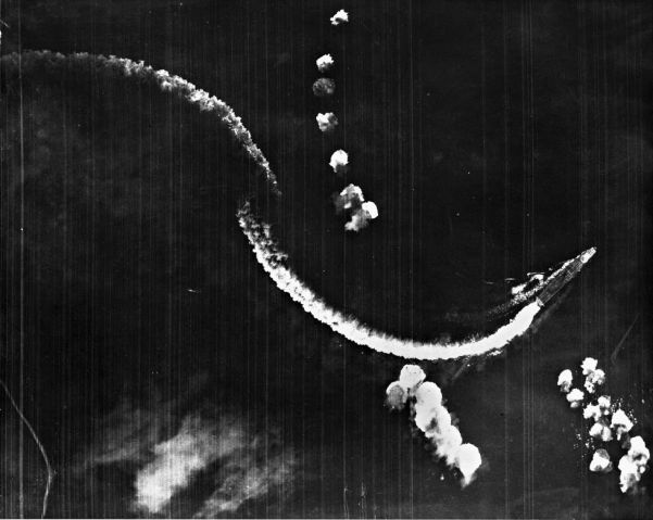 An aerial photograph of the Japanese carrier Hiryu during the Battle of Midway. The ship was set ablaze by a US air attack and subsequently scuttled