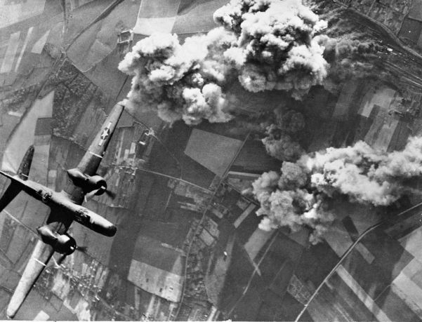 A US A-20 bomber hits an important rail junction at Busigny in northern France