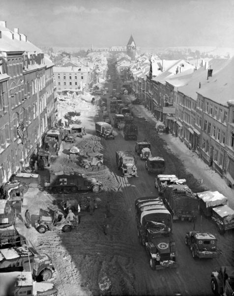 US troops and vehicles in Bastogne, which resisted all German assaults in December 1944 and January 1945